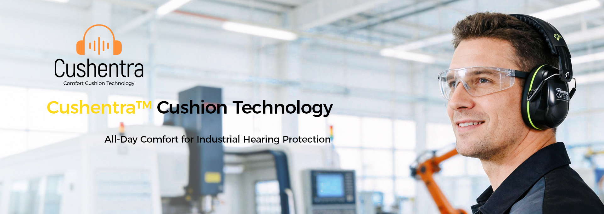 Worker wearing safety earmuffs and safety glasses in an industrial workplace, illustrating Cushentra™ cushion technology
